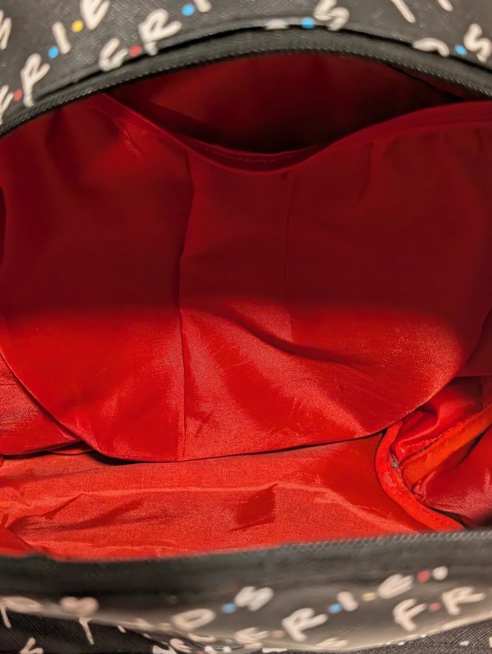 Friends Backpack all over print. need small repair see zoomed in photo